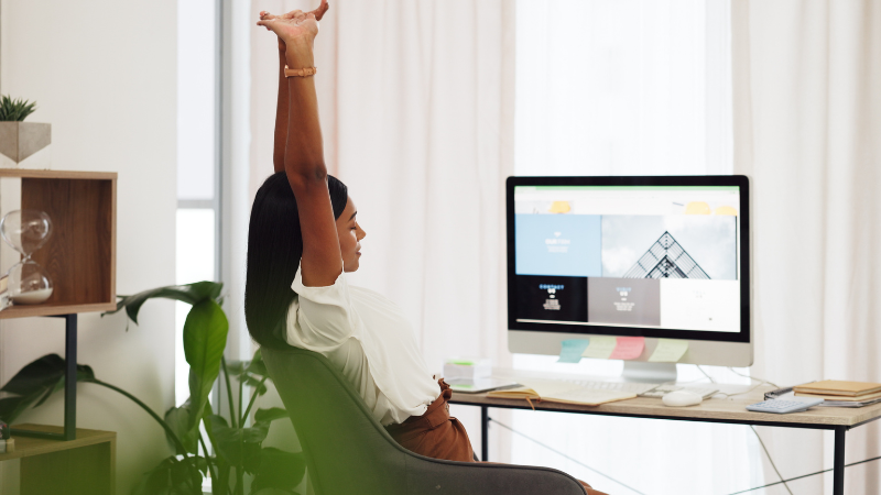 Woman stretching at desk