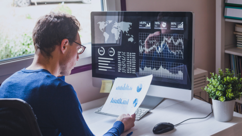 Person sat at computer using fintech