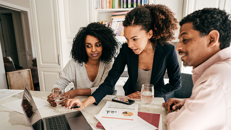 Professionals working together on a laptop